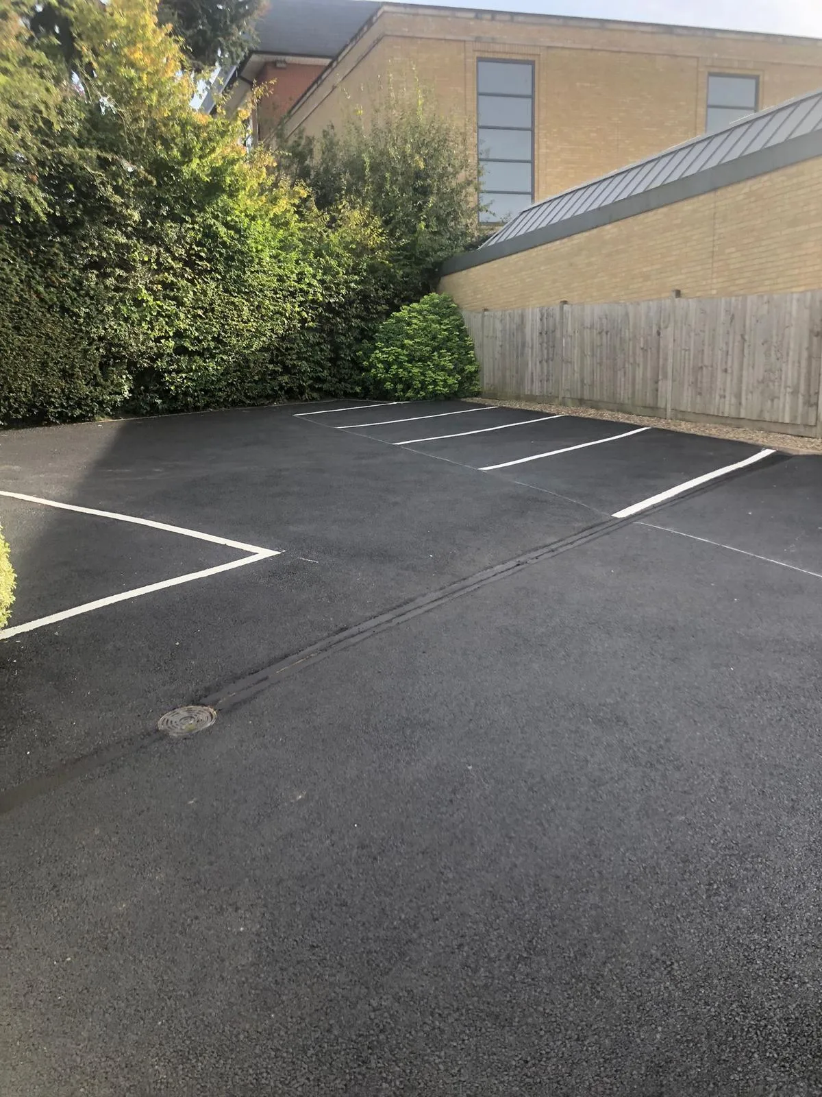 Crisp white bay markings on new tarmac