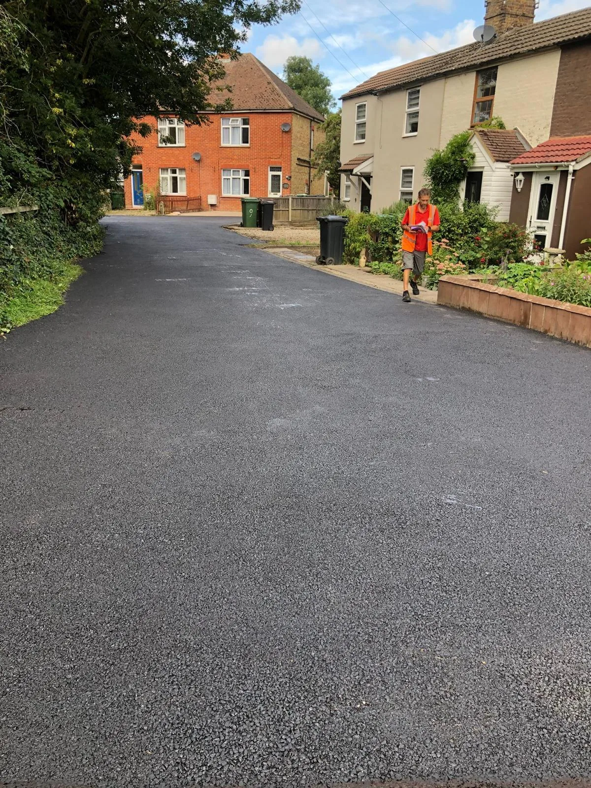 A residential driveway being resurfaced, with the team on site