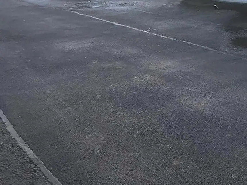A resurfaced car park seen across the bays