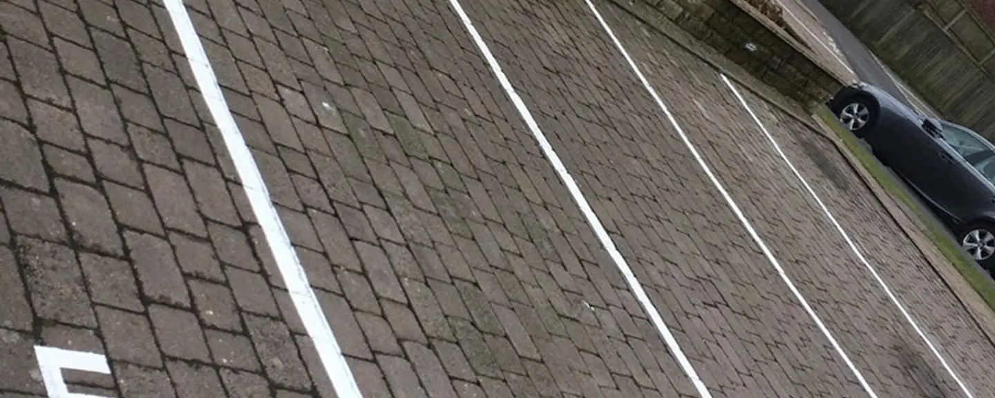 White bay markings set out on new tarmac — Car Park Resurfacing in Brompton by Meads Resurfacing
