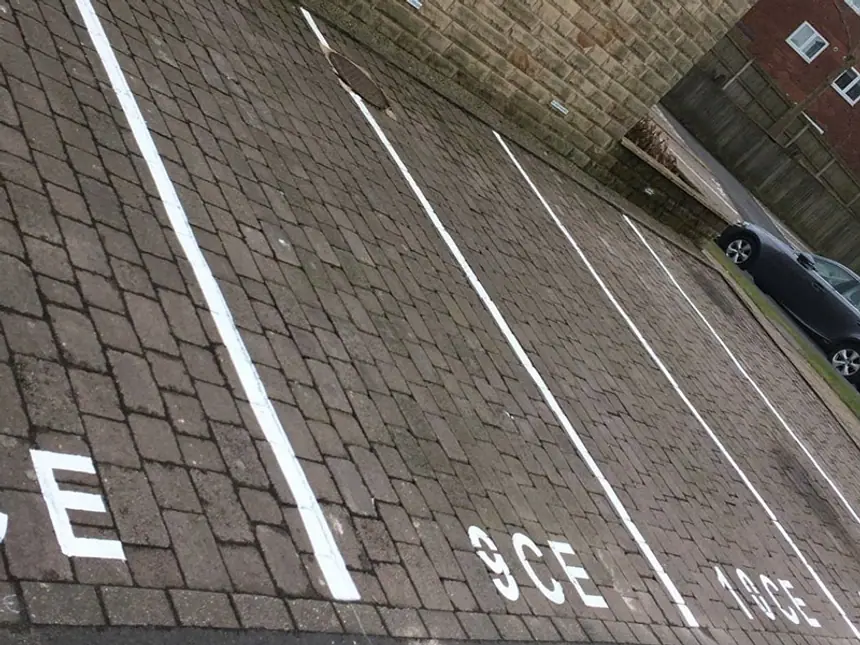 White bay markings set out on new tarmac