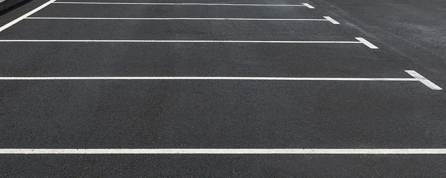 Empty parking bays on a resurfaced surface — Car Park Resurfacing in West Wickham by Meads Resurfacing