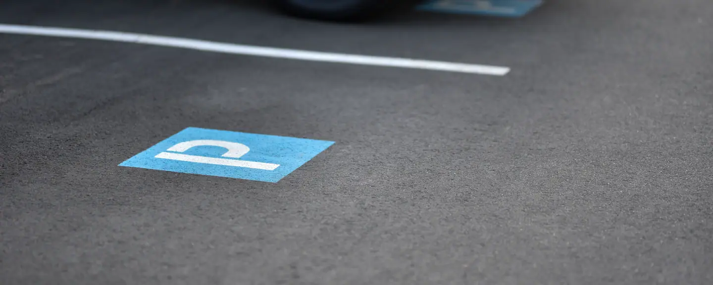 A blue disabled bay marking on new tarmac — Car Park Resurfacing in Gravesend by Meads Resurfacing