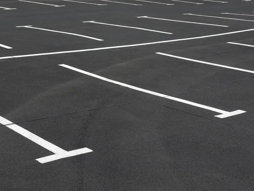 Directional arrows marked across a car park