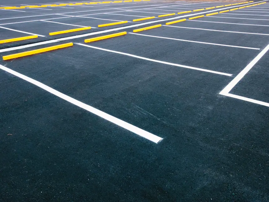 A car park laid out with yellow and white markings