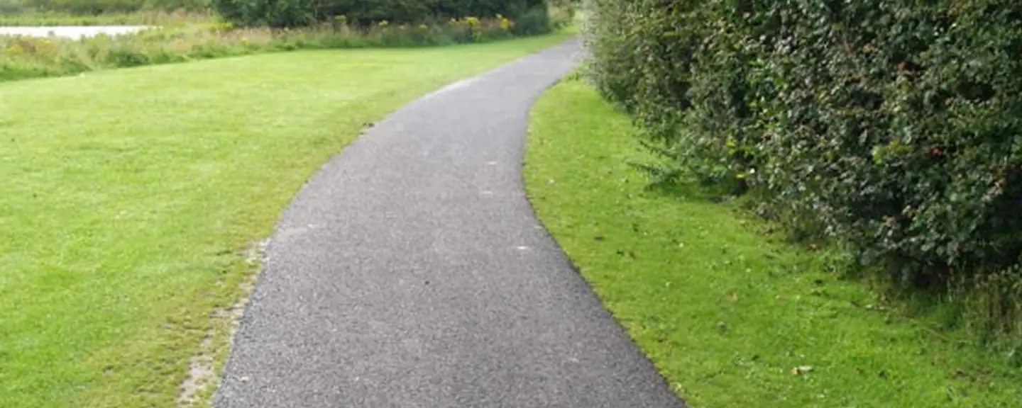A footpath resurfaced across an open green — Path Resurfacing in Folkestone by Meads Resurfacing