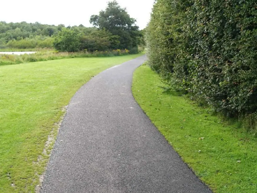 A footpath resurfaced across an open green