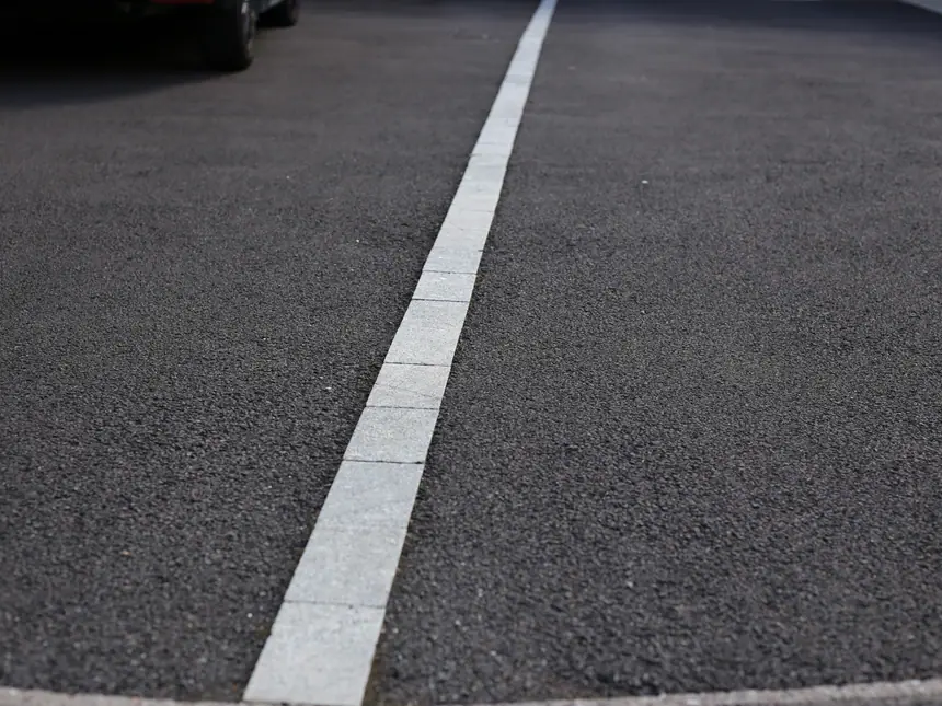 A marked edge line on a resurfaced path