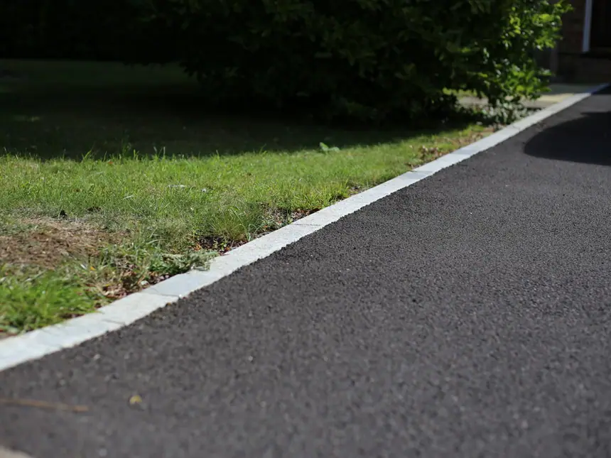 A tarmac path edge detail at the verge
