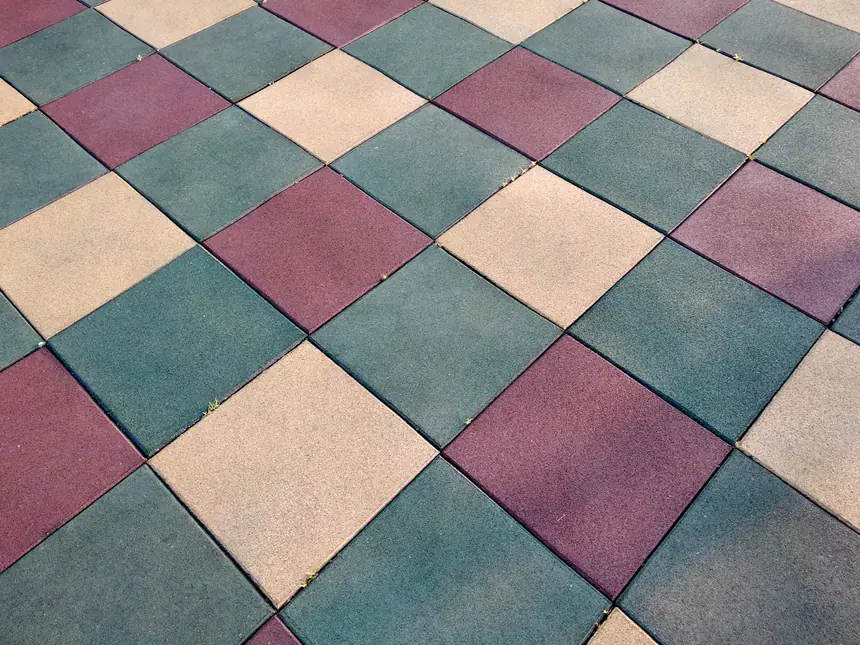 A play surface finished in coloured squares