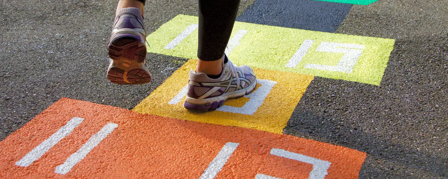 Hopscotch markings painted on a play surface — Playground Resurfacing in Hackney by Meads Resurfacing
