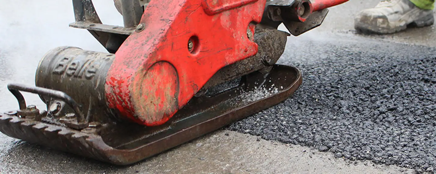 A completed asphalt patch over a filled pothole — Pothole Repairs in Folkestone by Meads Resurfacing