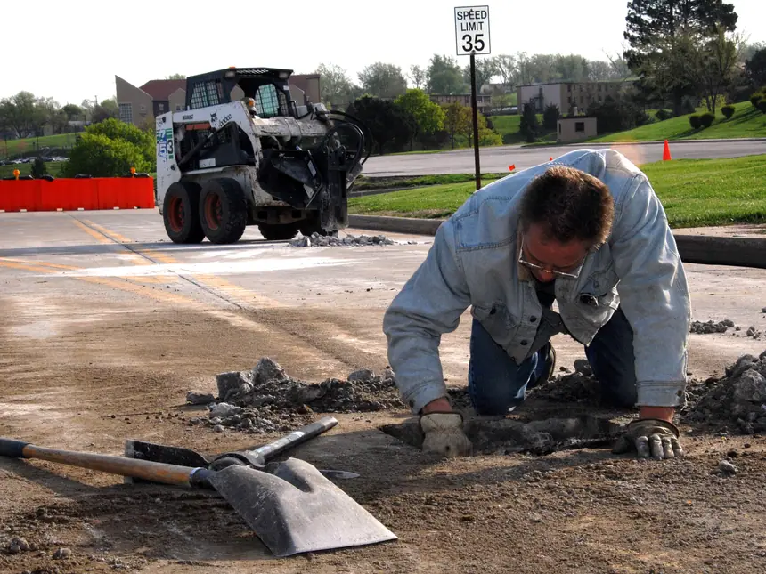A pothole repair under way in a road