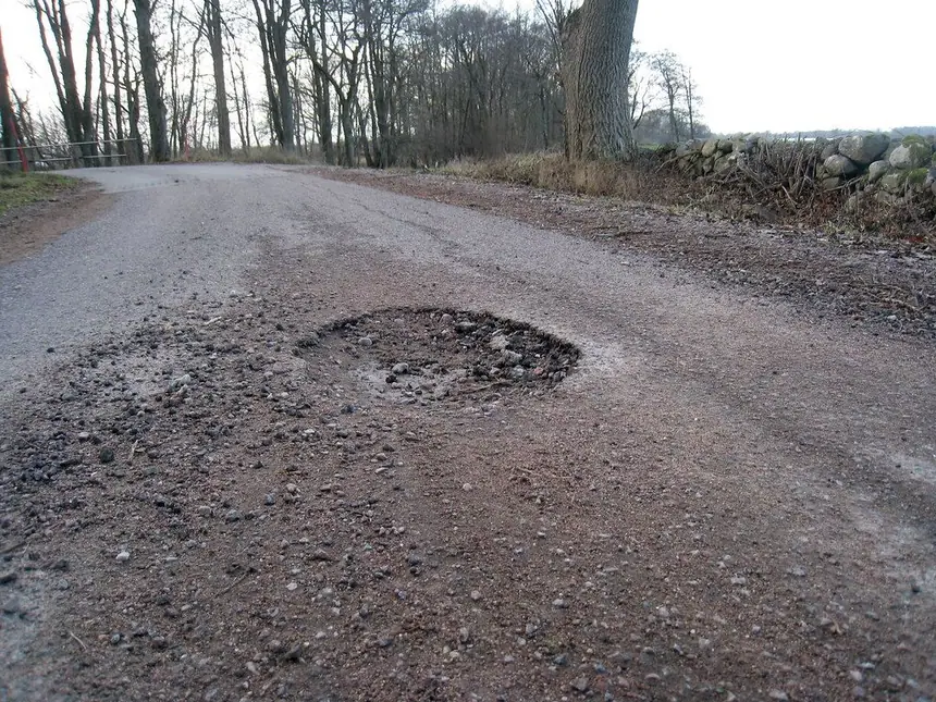 A repaired pothole blended into the road