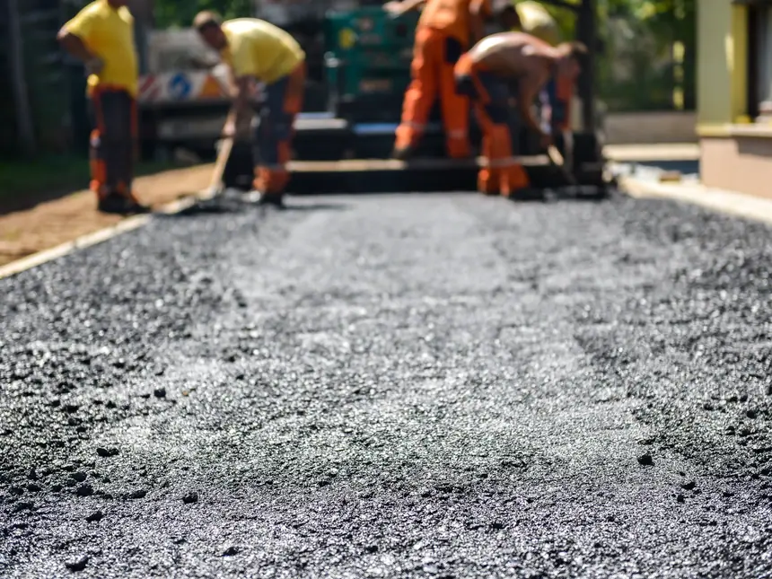 A fresh strip of asphalt beside the old surface