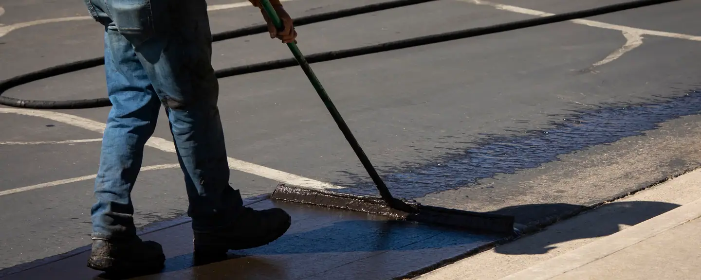 Sealant applied up to a painted line — Surface Dressing in Dover by Meads Resurfacing