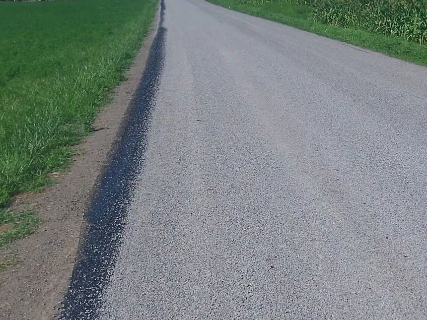 A tar and chip road surface