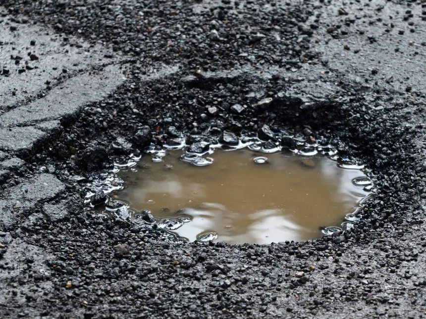 A patch repair cut into a road surface