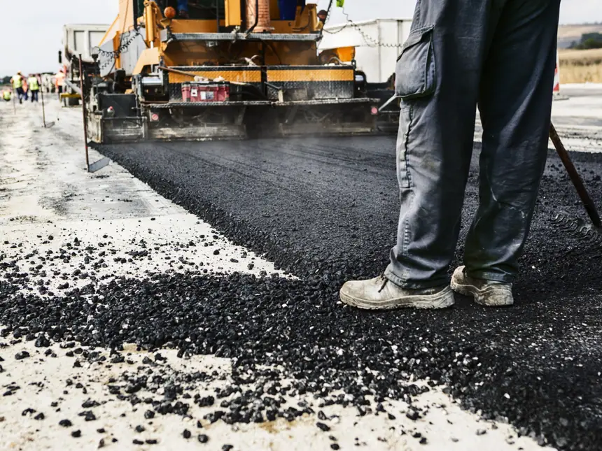 Loose tarmac behind a paving machine