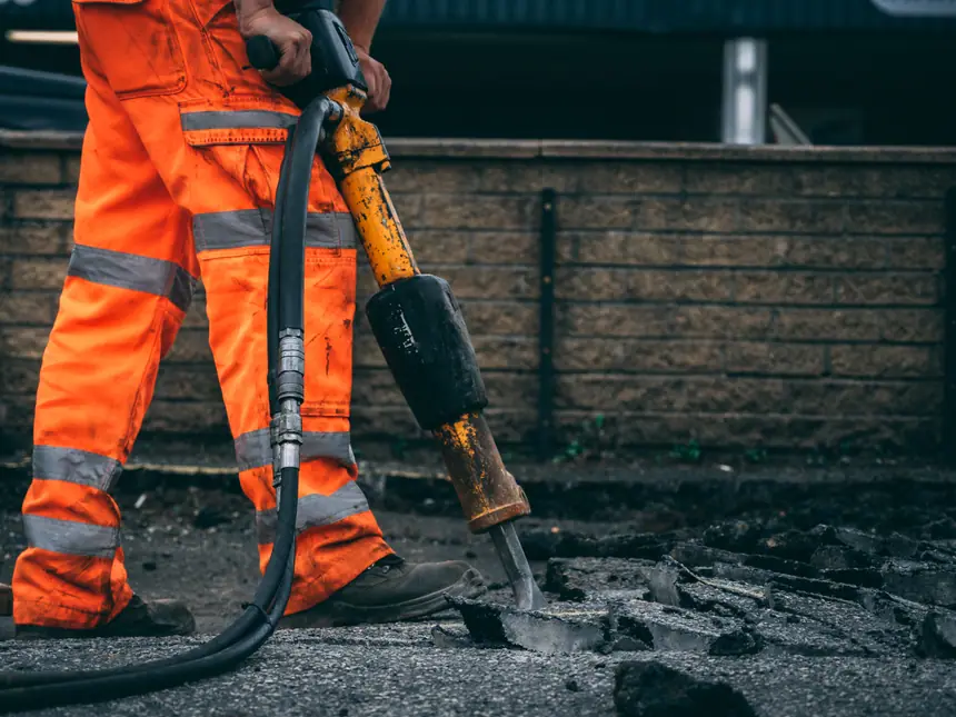 A hand lance being used on new tarmac