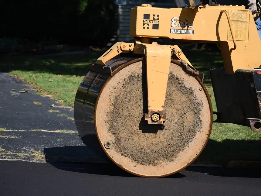 A roller wheel bedding in a tarmac repair