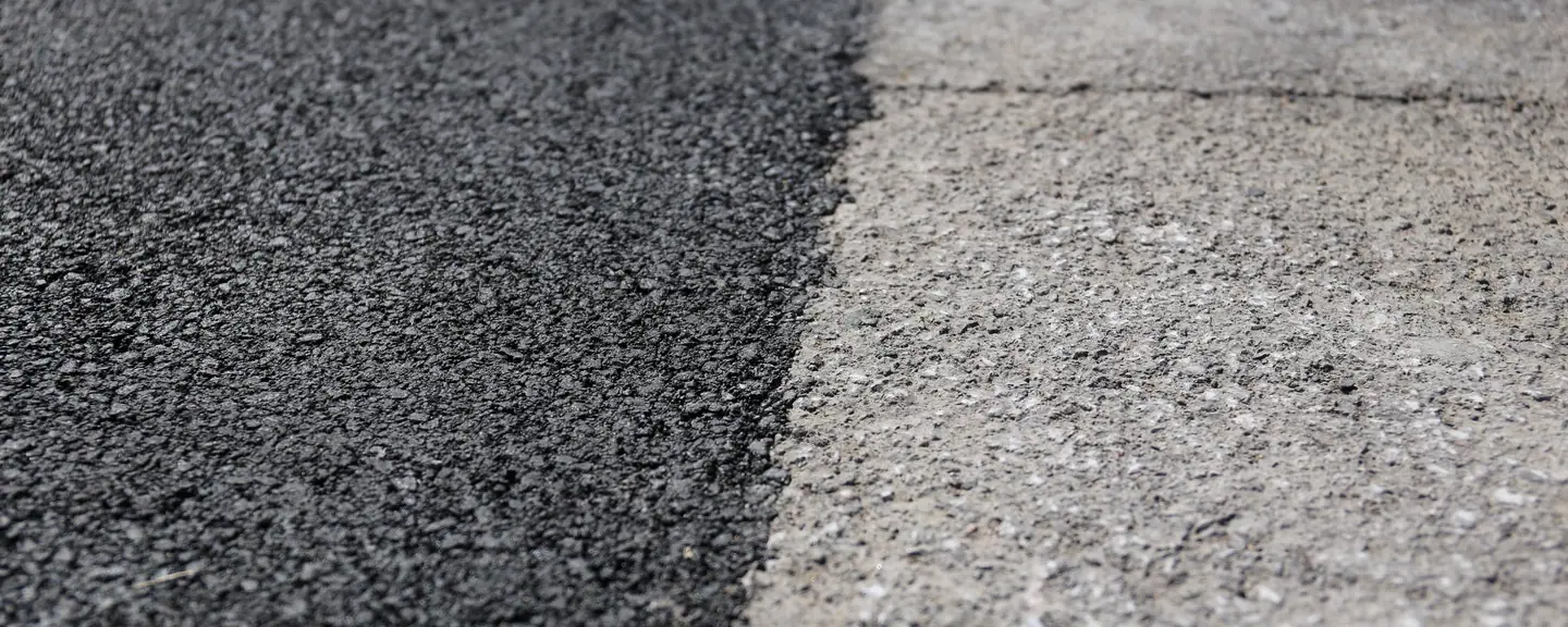A tarmac surface with a defined white edge line — Tarmac Contractors in Sutton by Meads Resurfacing