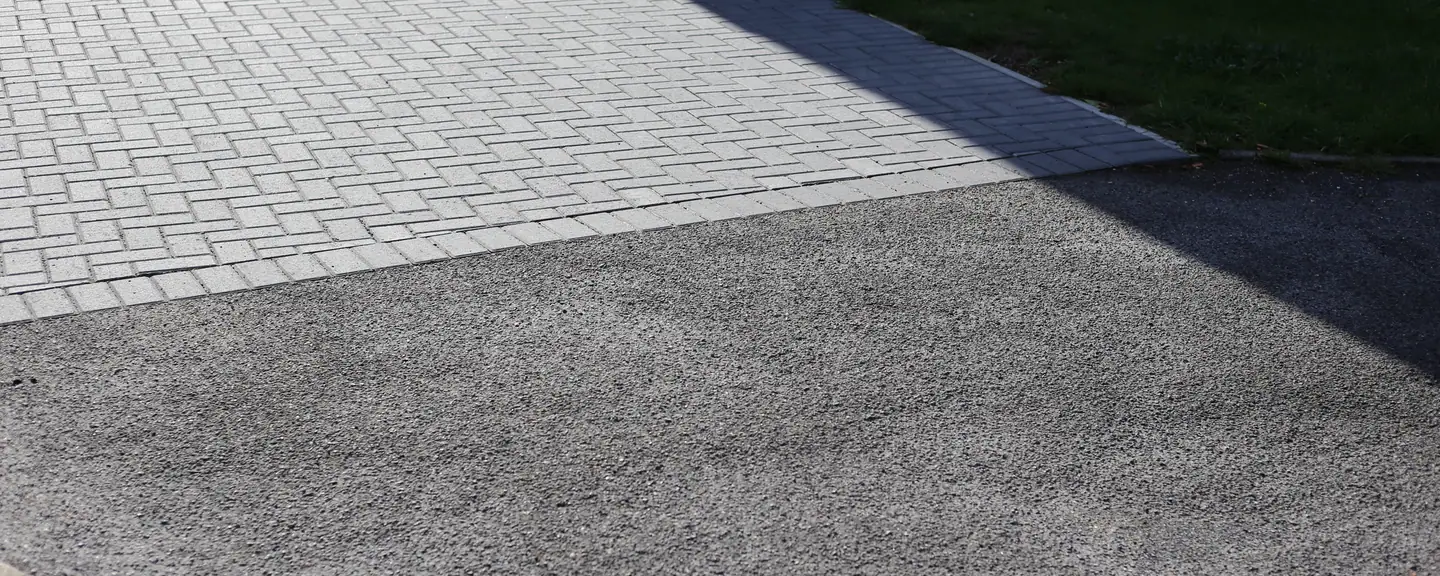 A wide tarmac driveway with a block paved border — Tarmac Driveways in Hillingdon by Meads Resurfacing