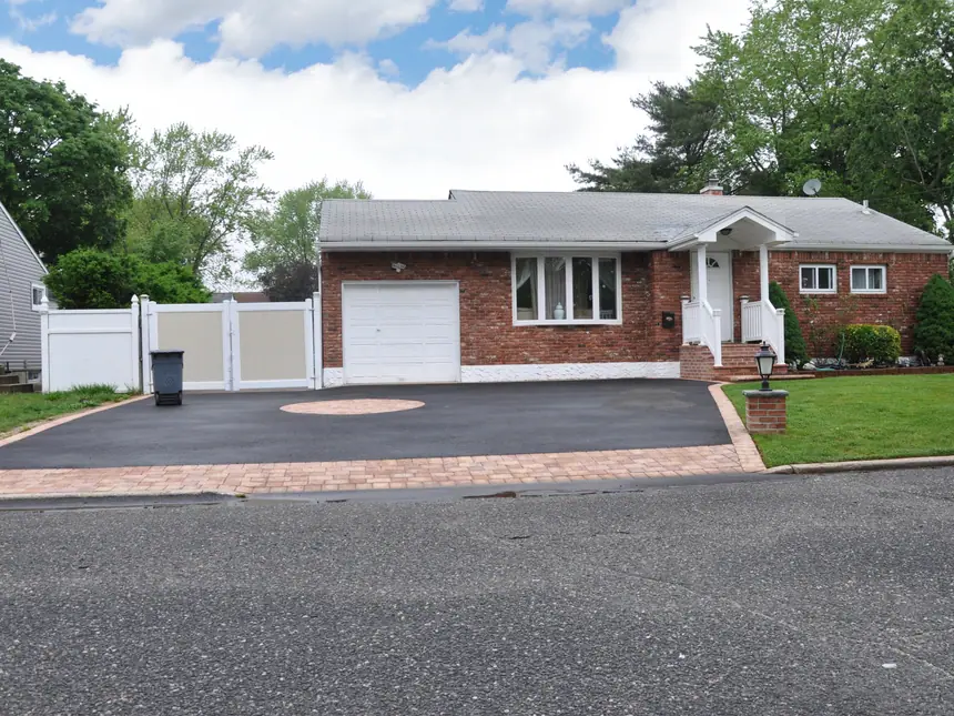 A tarmac driveway at a bungalow