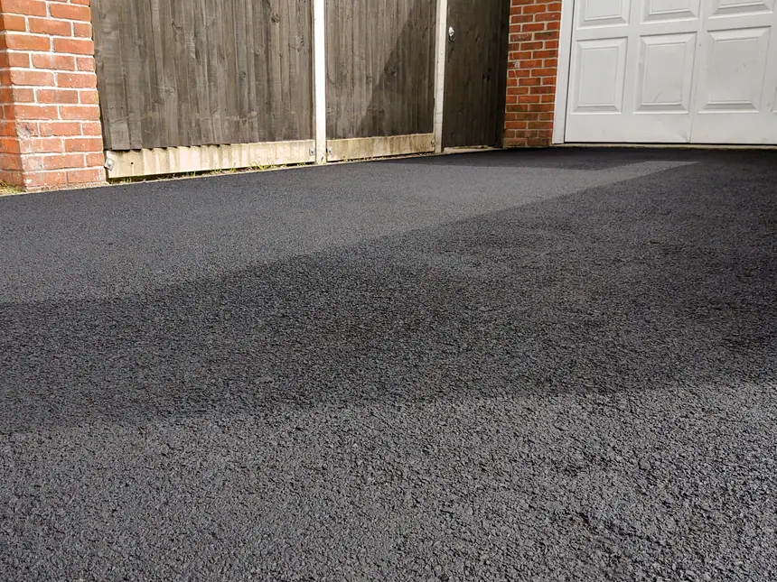 A newly laid tarmac driveway surface